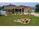 Attractive home with colorful landscaping, stone accents and charming curb appeal at 386 Westwinds Dr, Palm Harbor, FL 34683