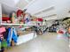 Organized garage space with ample shelving and storage for tools, bikes, and household items at 386 Westwinds Dr, Palm Harbor, FL 34683
