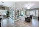 Bright living room with view of pool, featuring tiled floors and comfortable seating at 386 Westwinds Dr, Palm Harbor, FL 34683