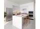 Modern kitchen boasts stainless steel appliances, a center island, and a sleek, minimalist design at 400 Central Ave # 808, St Petersburg, FL 33701