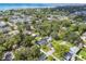 Picturesque aerial view capturing a residential area near the coast, showcasing lush trees and a variety of homes at 4009 S Renellie Dr, Tampa, FL 33611