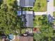 An aerial view shows a home with a long driveway and multiple outdoor features at 4009 S Renellie Dr, Tampa, FL 33611