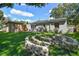 Charming backyard with an outdoor sitting area and unique fire pit, perfect for relaxation at 4009 S Renellie Dr, Tampa, FL 33611