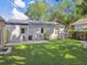 The backyard is perfect for outdoor dining and entertaining with a cozy patio at 4009 S Renellie Dr, Tampa, FL 33611