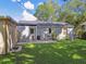 The cozy patio in the backyard is perfect for relaxing and enjoying the outdoors at 4009 S Renellie Dr, Tampa, FL 33611