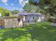 Lush backyard features a shed, patio area, and well-maintained lawn at 4009 S Renellie Dr, Tampa, FL 33611