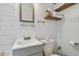 Clean and modern bathroom with floating shelves and a contemporary sink and vanity at 4009 S Renellie Dr, Tampa, FL 33611