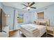 Charming bedroom boasts hardwood floors, a ceiling fan, and a window with natural light at 4009 S Renellie Dr, Tampa, FL 33611