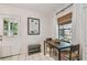 Cozy dining area with natural light, a wooden table, and tiled flooring at 4009 S Renellie Dr, Tampa, FL 33611