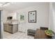 Bright kitchen with stainless steel appliances, white cabinets, and an adjacent dining area at 4009 S Renellie Dr, Tampa, FL 33611