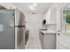 Efficient kitchen layout featuring stainless steel appliances and easy access to the backyard at 4009 S Renellie Dr, Tampa, FL 33611