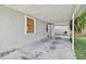 Spacious covered patio with a large window and an outdoor cooking area at 4009 S Renellie Dr, Tampa, FL 33611