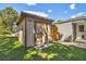 Exterior view of a shed with wooden doors and the house behind it at 4009 S Renellie Dr, Tampa, FL 33611