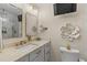 Beautiful bathroom with marble countertops, gold fixtures, and a wall-mounted TV at 4214 Harbor House Dr, Tampa, FL 33615
