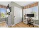Comfortable bedroom featuring a desk with natural light coming through the windows at 4214 Harbor House Dr, Tampa, FL 33615