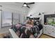 Well-decorated bedroom with a large window, ceiling fan, and stylish bedding at 4214 Harbor House Dr, Tampa, FL 33615