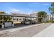 Exterior view of a carport showing two parked cars and property addresses at 4214 Harbor House Dr, Tampa, FL 33615