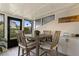 Cozy dining area with a wooden table and chairs, bright lighting, and stylish decor at 4214 Harbor House Dr, Tampa, FL 33615