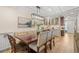 Dining room with a modern chandelier, adjacent to a beautifully appointed kitchen at 4214 Harbor House Dr, Tampa, FL 33615