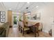 Well-lit dining room featuring modern light fixture, and access to the outdoor area at 4214 Harbor House Dr, Tampa, FL 33615