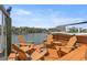 Scenic dock area with seating, a fire pit, and views of the waterway and boats at 4214 Harbor House Dr, Tampa, FL 33615