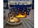 A cozy fireplace with black and white accents, stockings, and decorative trees that create an inviting atmosphere at 4214 Harbor House Dr, Tampa, FL 33615