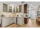 Charming kitchen features custom cabinets, wine fridge, and glass-front display cabinets at 4214 Harbor House Dr, Tampa, FL 33615