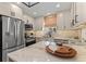 Well-equipped kitchen with stainless steel appliances, marble countertops, and ample storage at 4214 Harbor House Dr, Tampa, FL 33615