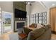 Comfortable living room with a fireplace, plush seating, and a view of the outdoors at 4214 Harbor House Dr, Tampa, FL 33615