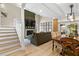 Spacious living room featuring a fireplace, staircase, and a view to the patio at 4214 Harbor House Dr, Tampa, FL 33615