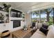 Comfortable living room with fireplace, large windows with a beautiful view, and cozy seating at 4214 Harbor House Dr, Tampa, FL 33615