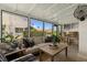 Bright sunroom with large windows offering plenty of natural light and comfortable seating at 4214 Harbor House Dr, Tampa, FL 33615