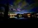 Nighttime waterfront view showing buildings reflected in the water underneath a colorful sky at 4214 Harbor House Dr, Tampa, FL 33615