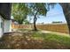 Expansive backyard featuring mature trees, a new wooden fence, and plenty of space for outdoor activities and relaxation at 4414 W Oklahoma Ave, Tampa, FL 33616