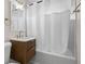 Bathroom featuring a vanity with a wooden cabinet, white countertop, mirror, and bathtub at 4414 W Oklahoma Ave, Tampa, FL 33616