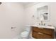 Half-bath displaying a modern vanity, toilet, and stylish fixtures at 4414 W Oklahoma Ave, Tampa, FL 33616
