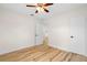 Bright bedroom with a ceiling fan and wood-look flooring, offering a comfortable space at 4414 W Oklahoma Ave, Tampa, FL 33616