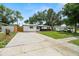 Charming single-story home with a well-maintained lawn and a long private driveway at 4414 W Oklahoma Ave, Tampa, FL 33616