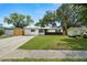 Charming home with a well-manicured lawn and a paved driveway, located in a desirable neighborhood at 4414 W Oklahoma Ave, Tampa, FL 33616