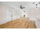 Bright open-concept living room featuring hardwood floors and recessed lighting at 4414 W Oklahoma Ave, Tampa, FL 33616