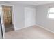 Bedroom with neutral carpeting and a closet at 4417 Kohler St, New Port Richey, FL 34652