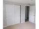 Bedroom with neutral carpeting featuring a closet at 4417 Kohler St, New Port Richey, FL 34652