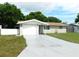 Charming single-story home with a freshly painted driveway and well-maintained lawn at 4417 Kohler St, New Port Richey, FL 34652
