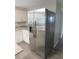 Updated kitchen with stainless steel refrigerator and elegant countertops at 4417 Kohler St, New Port Richey, FL 34652