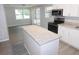 Bright kitchen with granite counters, stainless appliances, and center island at 4417 Kohler St, New Port Richey, FL 34652