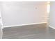 Neat living room featuring a window, wood-look flooring and baseboard at 4417 Kohler St, New Port Richey, FL 34652