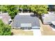 Aerial view of the home's roof, driveway and surrounding trees at 4638 Durney St, New Port Richey, FL 34652