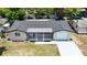 An aerial view of a one-story home with a driveway and well maintained roof at 4638 Durney St, New Port Richey, FL 34652