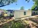Exterior view showcases a well-maintained home with a covered patio and spacious backyard at 4638 Durney St, New Port Richey, FL 34652