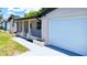 Close up of the exterior of a charming single-story home with a one car garage at 4638 Durney St, New Port Richey, FL 34652